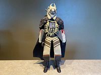 Full view of figure standing upright