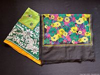 Both scarves laid flat showing overall patterns and colors