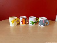 Front view of all four animal mugs
