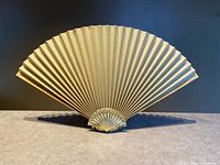 full front view of lamp showing fan shade and seashell base