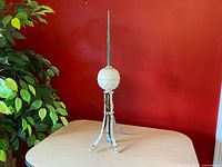 Full view of lightning rod finial showing spire, ball and base