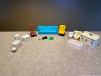 Overview of all plastic dollhouse furniture pieces