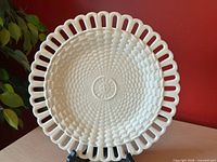 front view showing basketweave pattern and pierced rim
