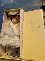 Full view of doll inside original yellow Eaton Beauty box