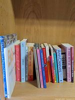 Full shelf of assorted books left to right