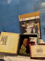 Complete boxed Chaturanga game opened showing rulebook, pouches, pieces and inner tray