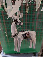 Front of retail box showing reindeer image, product title, size