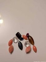 Group view of all 11 loose stones on white background