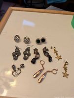 All seven pairs of earrings laid out overview