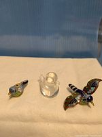 Front view of all three bird figurines