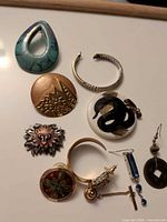 Group overhead shot showing all nine jewellery pieces