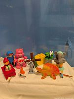 Group shot of all toy figures and blocks on cloth