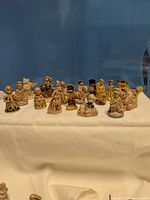 Full group of Wade miniatures on display cloth
