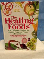 Front cover of "The Healing Foods" hardcover book
