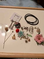 Overall view of all jewellery pieces laid out on tray