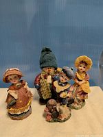 Front view of all four figurines