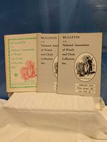 Front view of all three Bulletin issues