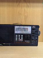 Front view showing brand, model, speaker and control panel