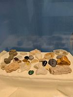 overview of all assorted mineral and polished stones laid out on cloth