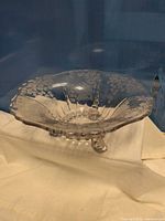 Full view of clear etched glass bowl showing scalloped rim and overall shape