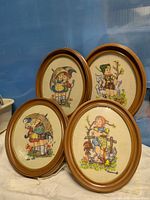 Four oval framed Hummel crewel pictures grouped