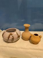 Three pottery pieces side by side