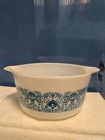 Front view of white Pyrex bowl showing full blue Medallion pattern band