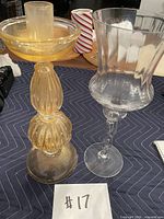 Both candle holders side by side for scale and style comparison