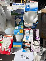 Group of boxed and loose bulbs including Bulbrite, Sylvania, Satco, loose PAR flood