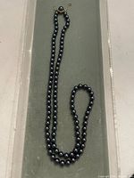 Full view of entire 30-inch pearl strand laid out