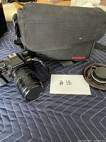 Pentax P3 camera with 35-70mm lens, caps, and Pentax bag