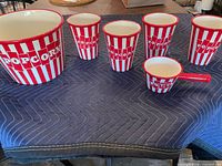 Full view of entire six-piece popcorn set on table