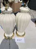 Two ivory ceramic lamps front view