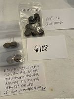 Bag of 1943 steel cents, individual flips with Indian Head cents, handwritten year list