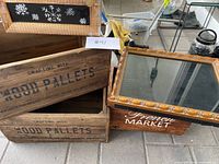Overview of two wooden crates and shadow box