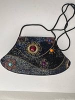 Full view of beaded evening bag showing shape, strap, beadwork