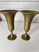 Both brass vases side by side showing overall form and engraving