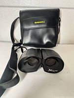 Binoculars front view with carry case and strap