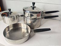 Frying pan, saucepan with lid, double-boiler with lid and insert