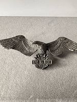 Full view of eagle motorcycle pin with wings spread