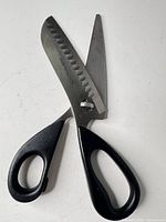 Full view of KitchenAid kitchen shears with black handles and stainless blades