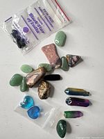 Full assortment showing all stones, aura points, glass hearts, and labeled bag