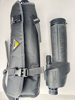 Scope with soft case and strap displayed side by side