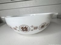 Side profile showing exterior brown medallion pattern and handles