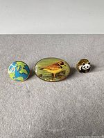 All three enamel pins front view