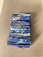 Top view showing rectangular blue iridescent shell pieces forming bracelet