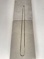 Full view of necklace laid flat