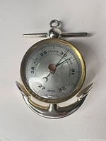 Front view showing complete barometer, anchor form