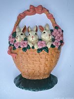 Full view of cast iron bunny basket doorstop