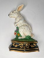 Full view of white cast iron rabbit doorstop